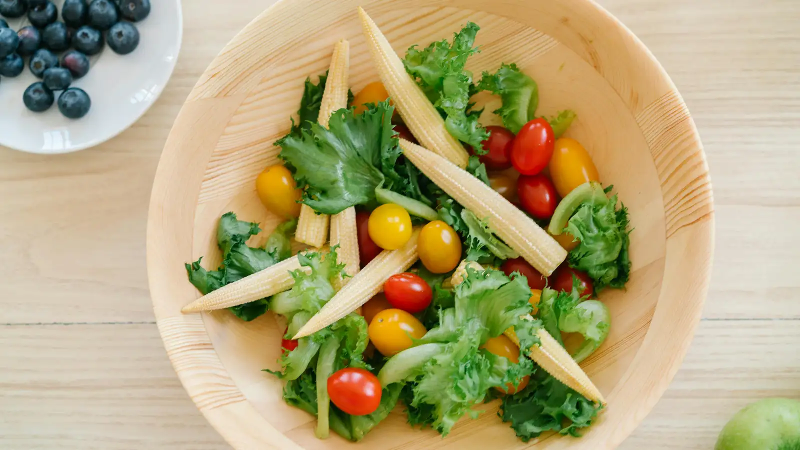 Bamboo salad bowl with fresh greens